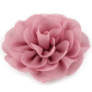 Close-up detail of dusty rose chiffon flower hair clip with layered soft fabric petals