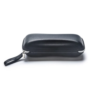 Sleek black lychee grain leather sunglasses case with silver zipper and portable strap