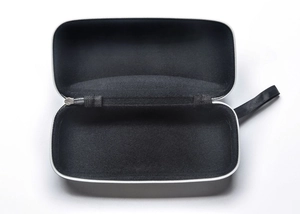 Detail of black EVA leather glasses case interior with elastic strap and fabric lining