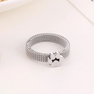 Detailed close-up of mesh texture and cute hollow paw print design on stainless steel ring