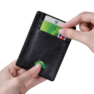 Macro view of RFID genuine leather card holder with multiple slots and thumb notch