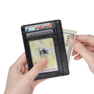 Slim RFID leather card holder with clear ID window and side pocket for cash storage