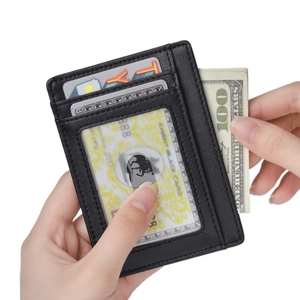 Detailed view of black leather RFID card holder featuring multiple slots and ID window