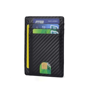 Slim black RFID blocking leather card holder with carbon fiber texture and three card slots