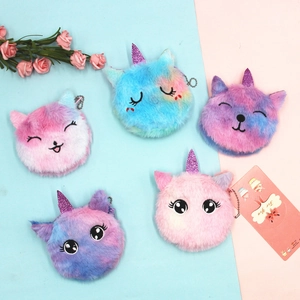 Plush unicorn mini coin purses with sequins and bead chains on pink and blue background