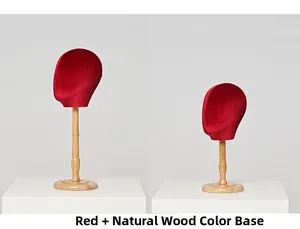 Detail of red velvet mannequin heads with solid wood base for hats and scarf display