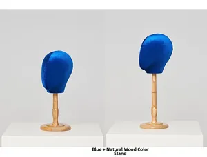 Detail of blue velvet mannequin heads with natural wood bases for hat display
