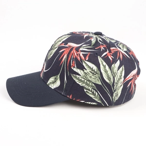 Close-up of side view on navy blue baseball cap with tropical bird of paradise floral print