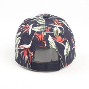 Detail view of tropical floral print baseball cap with adjustable strap closure