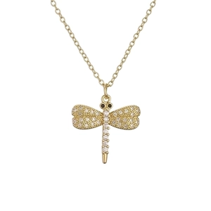 Elegant gold dragonfly pendant necklace with sparkling clear crystals on white background