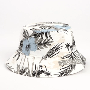 White bucket hat with blue floral and palm leaf print, summer sun protection accessory