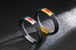 Detail of woven leather medical alert bracelets with gold and silver magnetic metal clasps