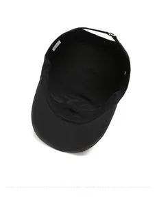 Detail showing internal structure, sweatband, and adjustable strap of a black military cap