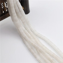 Close-up of white natural stone spacer beads for DIY jewelry making necklace accessories
