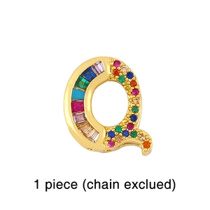 Detailed view of Q-shaped pendant with rainbow cubic zirconia in gold plated metal