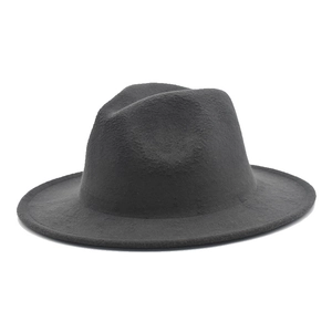 Detailed close-up of dark charcoal wool felt fedora showing thick fabric texture