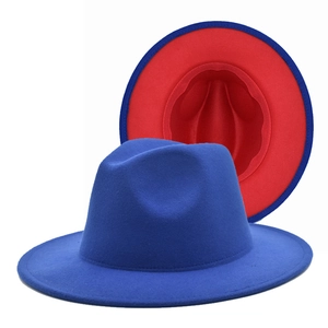 Detail of blue wool fedora hat showing vibrant red interior lining and wide flat brim