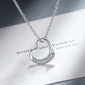 Elegant silver heart pendant necklace with shimmering paved stones on a fine O-chain