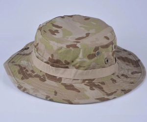 Detail of Multicam boonie hat showing metal air vents and tactical MOLLE webbing straps
