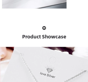 Detailed close-up of a delicate silver heart necklace chain with jewelry display card