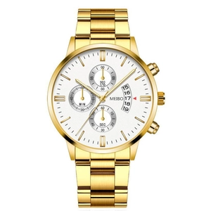 Close-up of golden quartz watch dial with chronograph sub-dials and date window