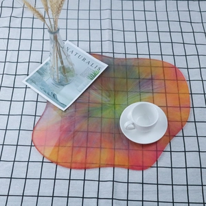Irregular rainbow acrylic tray with wavy edges on a checkered background for home decor