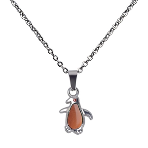 Macro view of temperature color-changing penguin pendant with stainless steel chain