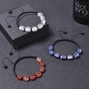 Three handmade woven bracelets with natural stones including sodalite and agate stones