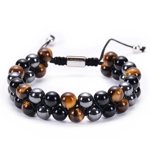 Macro detail of double-layer Tiger Eye and Hematite stone beads with adjustable cord