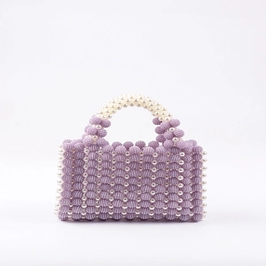 Handmade purple beaded handbag with white pearl accents and elegant woven design