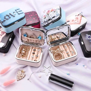 Portable jewelry box with mirror for rings and earrings featuring various colorful patterns