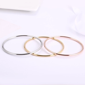 Minimalist 3mm stackable titanium steel bangles in silver, gold, and rose gold colors