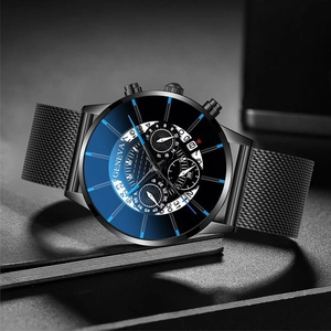 Close-up of Geneva men's black mesh watch with blue glare glass and calendar dials