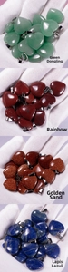 Detail shot of heart-shaped natural agate pendants in various stone types and colors