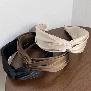 Elegant twist knot headbands in black, brown, and beige silk fabric for women
