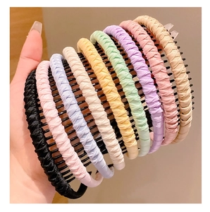 Detail view of 10 colorful fabric non-slip headbands with plastic teeth for girls