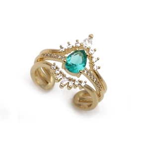 Detail of adjustable gold ring with pear-cut green zircon and micro-pave crystals