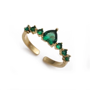 Top view of gold-plated adjustable ring featuring a heart-shaped green zircon and side accents