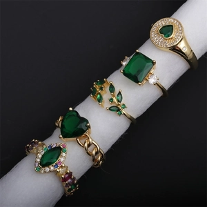Adjustable gold plated ring set with green cubic zirconia in various geometric heart shapes
