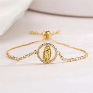Detailed shot of golden Virgin Mary charm bracelet with white zircon and adjustable clasp