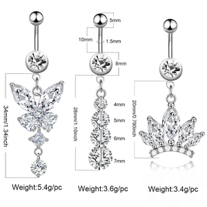 Three silver stainless steel belly rings with butterfly and crown charms in detailed size view