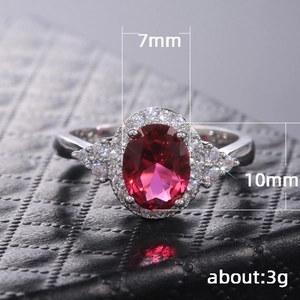 Classic silver-plated ring with a 7mm oval red ruby and pave-set white zircons