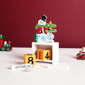Wooden Christmas countdown calendar with snowman figurine and monthly date blocks