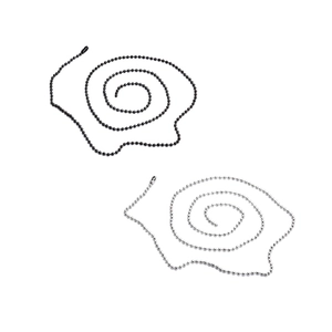 Detail view of black and silver stainless steel ball chains coiled on a white background