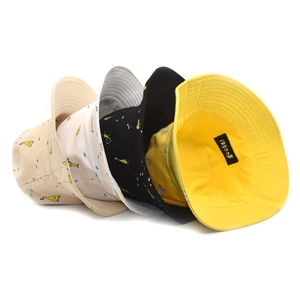 Detail of multi-color cotton bucket hats with cute goose prints and reinforced stitching