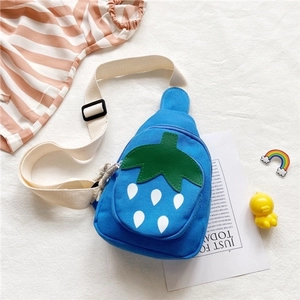 Detail of blue strawberry canvas chest bag for kids with adjustable strap and cute pattern