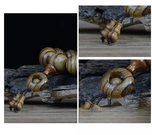 Macro detail of 108 wooden prayer beads with natural tiger stripe patterns and wood texture