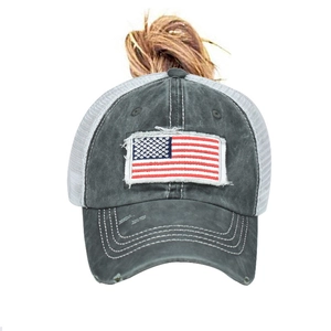 Close-up of ponytail opening and American flag embroidery on washed cotton baseball cap