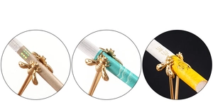 Detailed views of gold bee cigarette holder ring showing usage with various filters