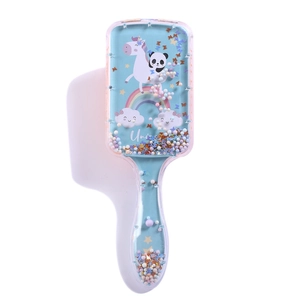 Detail of transparent air cushion hairbrush with colorful liquid quicksand and glitter